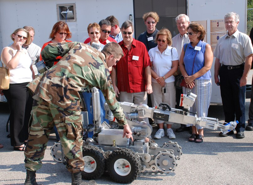 Robots and bosses...An employer was able to make a "bang" at Boss Day 2007 as the 932nd Airlift Wing gave civilian employers of 932nd Airlift Wing Reservists a chance to see military life behind the scenes, and push a few explosive buttons.  The explosive ordnance disposal team set up a demonstration of robotics and "charges" for the visitors.  The commander and staff members gave briefings and a base tour was included.  Photo/Tech Sgt. Gerald Sonnenberg