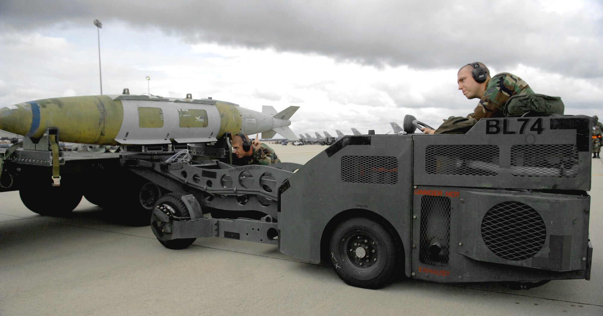SHAW AIR FORCE BASE, S.C. -- Staff Sgt. Christopher Brooks (left), 55th Aircraft Maintenance Unit, helps Senior Airman Michael Kavanaugh, 55th AMU, load a munition onto a MJ-1B bomb lift during an operational readiness exercise Oct. 4. OREs help Airmen prepare for deployments to combat environments. (US Air Force photo/Airman 1st Class Kathrine McDowell)
