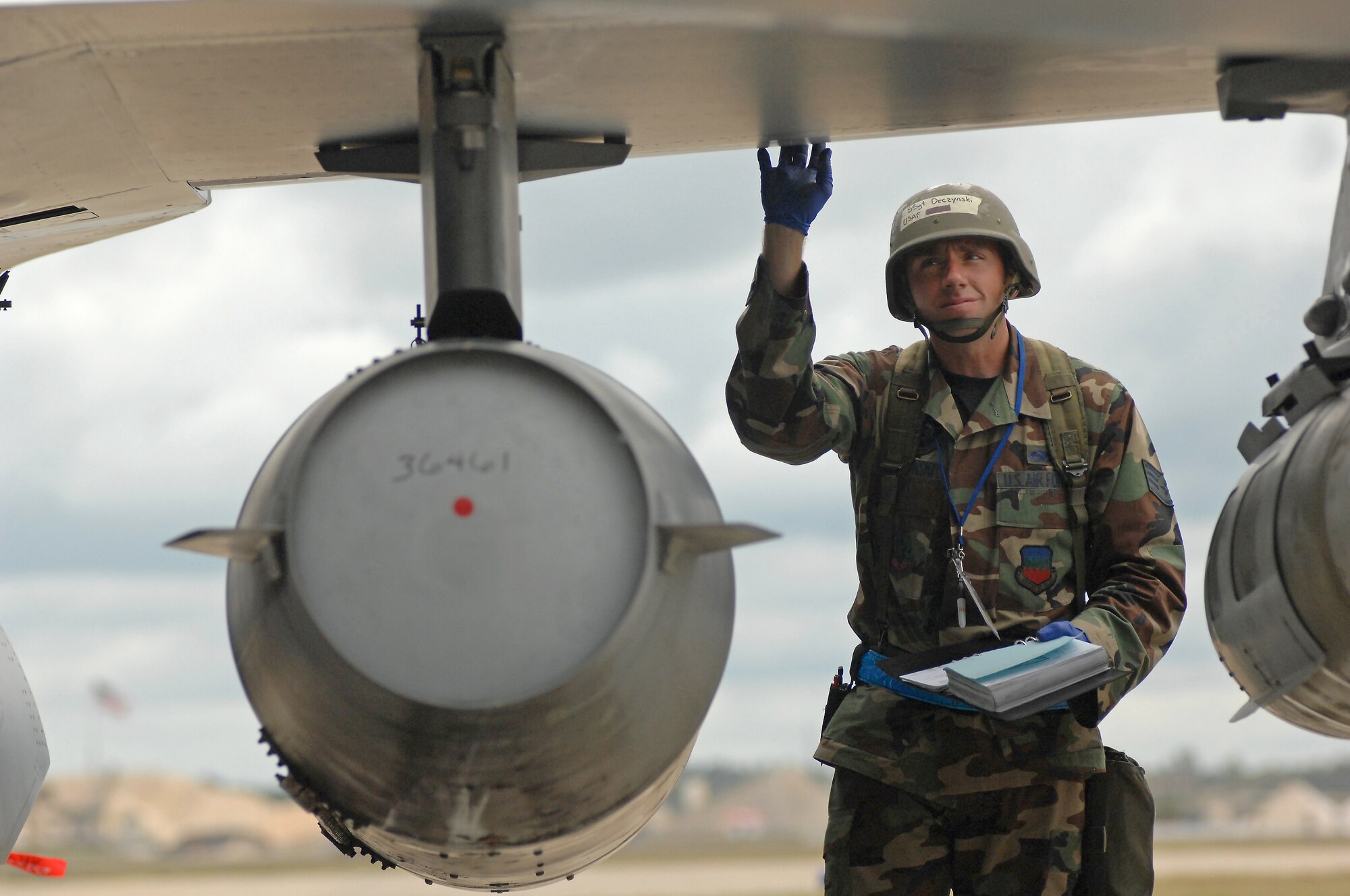 SHAW AIR FORCE BASE, S.C. -- Staff Sgt. James Deczynski, 55th Aircraft Maintenance Unit, checks the underside of an F-16 Strike Eagle wing during an operational readiness exercise Oct. 4. An ORE prepares Airmen in deployment procedures. (U.S. Air Force photo/Airman 1st Class Kathrine McDowell)