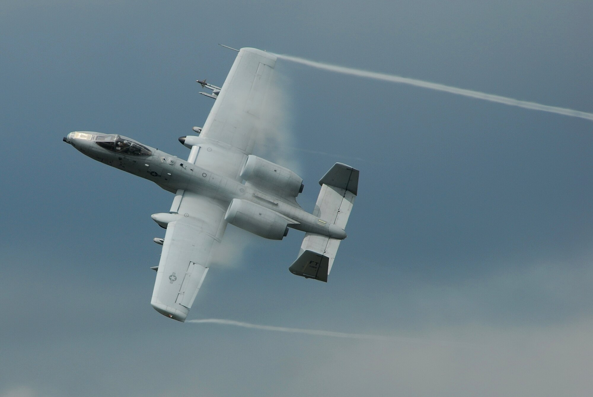 MOODY AIR FORCE BASE, Ga. -- An A-10C Thunderbolt II ground attack aircraft pulls up sharply out of a low-level strafing run during a combat search and rescue demonstration here Oct. 4.  The digitally-upgraded A-10C is equipped with satellite-guided precision weaponry and advanced communications data links for transferring information with ground-based warfighters.  (U.S. Air Force photo by Tech. Sgt. Parker Gyokeres)