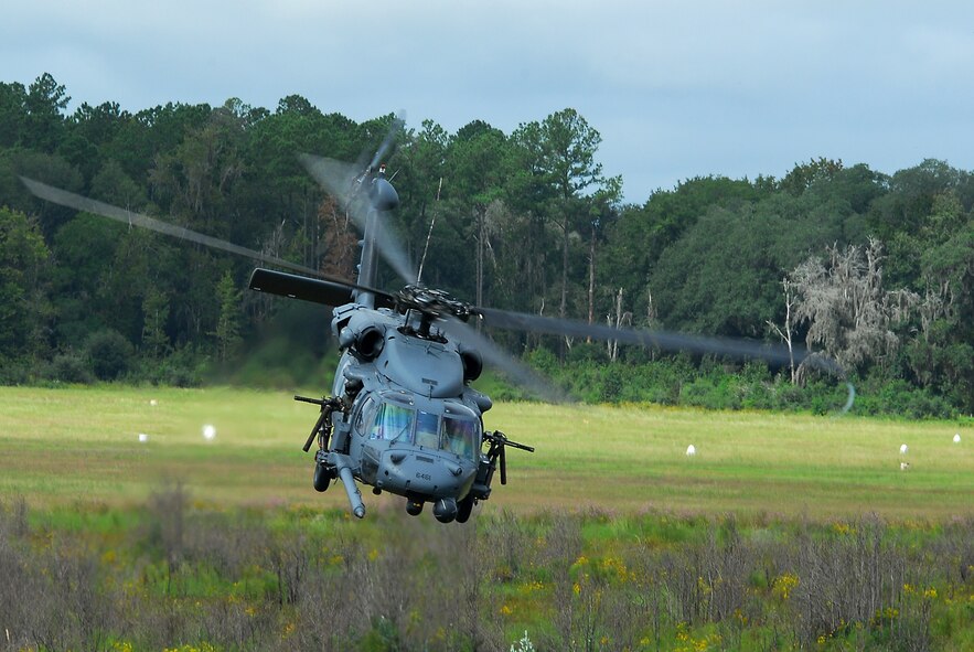 MOODY AIR FORCE BASE, Ga. -- An HH-60G Pave Hawk from the 41st Rescue Squadron banks out of a landing zone after retrieving a simulated downed aviator during a combat search and rescue demonstration here Oct. 4.  The multi-unit demonstration highlighted the CSAR capabilities of the Flying Tigers with pararescuemen from the 38th RQS, Pave Hawks, A-10C Thunderbolt II close air support fighters and HC-130P Combat King search and rescue aircraft.   (U.S. Air Force Photo by Tech. Sgt. Parker Gyokeres)

