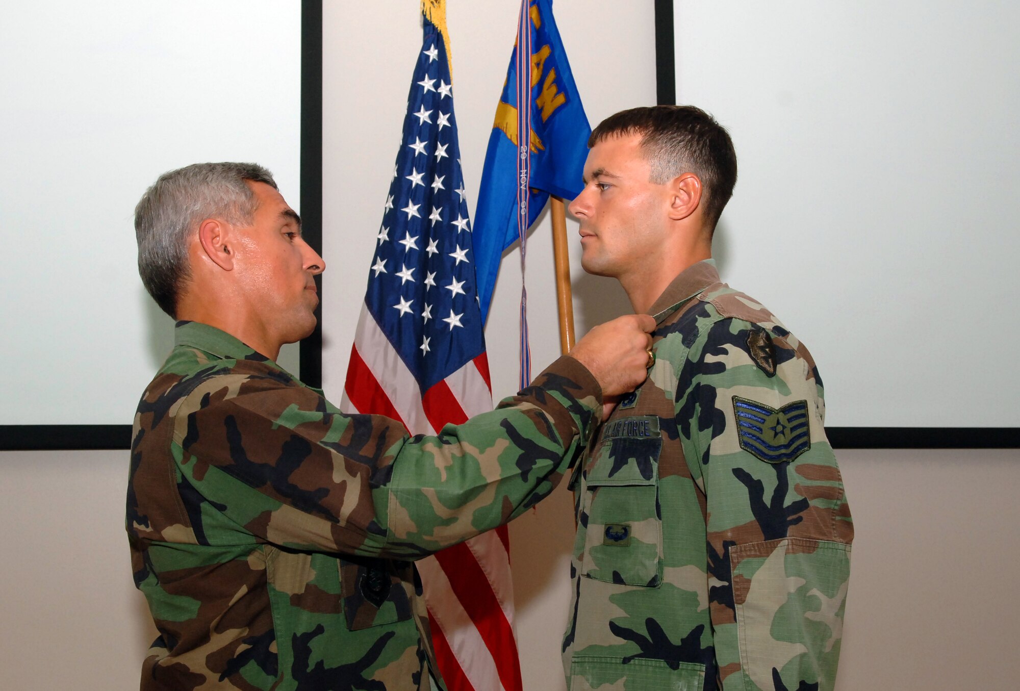 Col. JJ Torres, 15th Airlift Wing commander, pins the Bronze Star on Tech. Sgt. Steven Reedy, 25th Air Support Operations Squadron, during a ceremony at Hickam AFB, Oct. 4. 