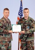 Lt. Col. Brian Duffy, 316th Civil Engineer Squadron commander, stands with Senior Airman Tristan Brubacher after presenting him the Army Commendation Medal, Sept. 25. (Courtesy Photos)
