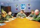 Maj. Gen. Frank Gorenc, Air Force District of Washington commander, center, surrounded by Col. Kim Johnson, 844th Communications Group commander, Col. Paul Christianson, 79th Medical Wing vice commander, Col. Kurt Neubauer, 11th Wing commander and Col. Paul Ackerley, 316th Wing commander, sign their Combined Federal Campaign contribution forms in the AFDW conference room Oct. 3. (US Air Force/Bobby Jones)