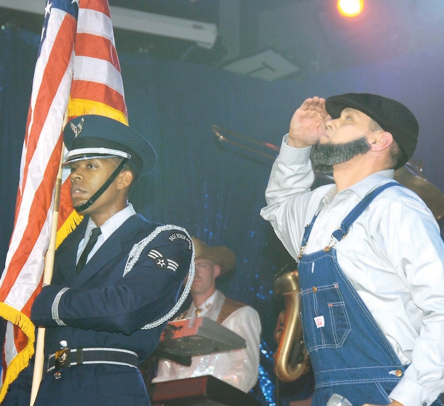 Tyrone Jones, 5, performs to "Twist," a 60's dance sensation with Senior Airman Jonathan Hayden, a cryptolographic switching systems journeyman from the 609th Air Communications Squadron, Shaw Air Force Base, SC, during the Tops in Blue show Sept. 28.  Tyrone is a Temple Hills, Md. resident. (US Air Force/Bobby Jones)