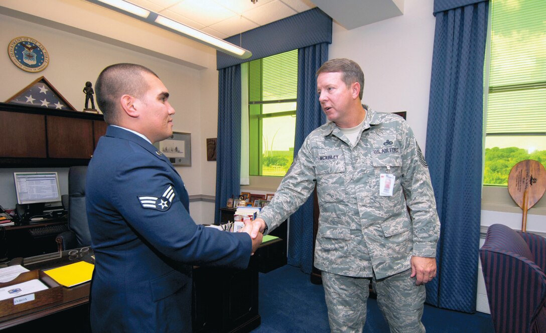 Senior Airman Justin H. Shults, 1st Helicopter Squadron flight engineer, meets Chief Master Sergeant of the Air Force Rodney J. McKinley, at the Pentagon, Sept. 28. Airman Shults was recognized as the Staff Sgt. Henry E. "Red" Erwin Outstanding Enlisted Aircrew Member of the Year.  This award is given annually to Flight Engineers, Loadmasters, Air Surveillance Operators and related career fields for their outstanding leadership and sustained self-improvements in support of enlisted aircrew operations.(US Air Force/SSgt Suzanne Day)