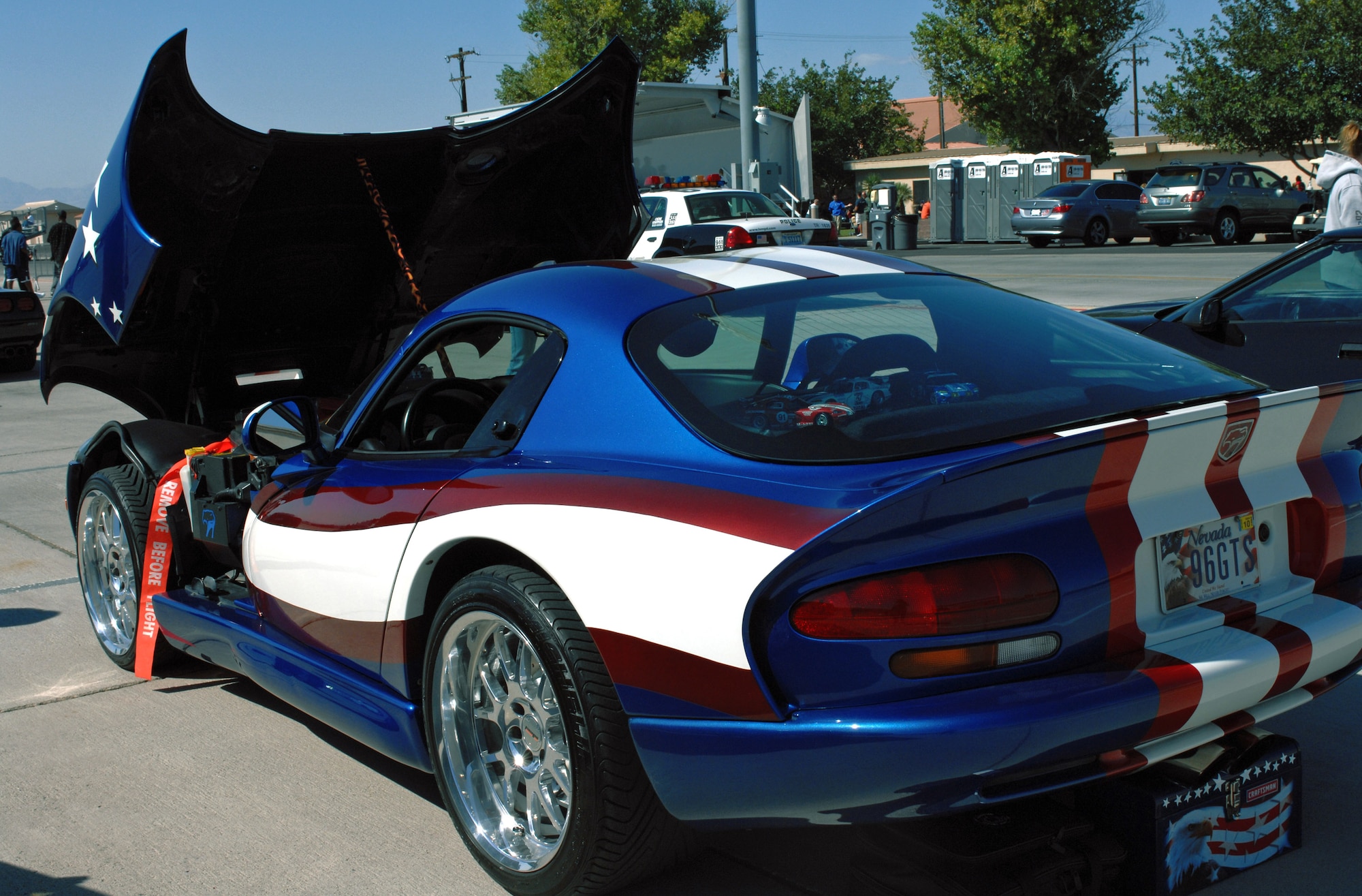 Individuals showcase their cars at the Nellis Autocross Sept. 29 at Nellis Air Force Base, Nev. The autocross is a two-day event that includes a fighter vs car race, a mile shoot out, and a car show. Airmen from Nellis and Creech Air Force bases participated during the events. (U.S. Air Force photo/Airman Stephanie Rubi) 