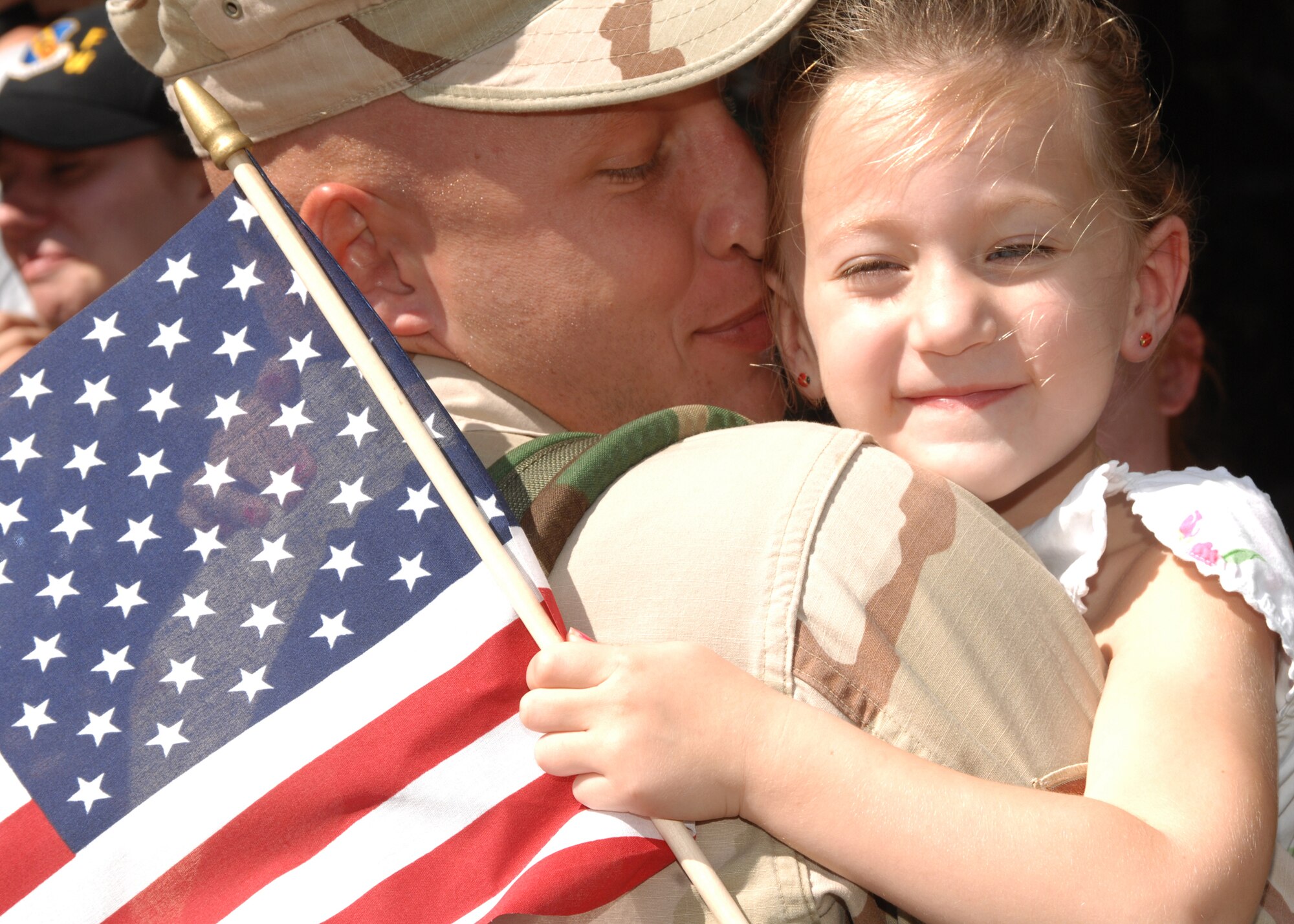 SEYMOUR JOHNSON AIR FORCE BASE, N.C. - Staff Sgt. Nathan Krueger, 4th Aircraft Maintenance Squadron, hugs his daughter Olivia after returning from his deployment, October, 1. (U.S. Air Force photo by Airman 1st Class Greg Biondo)