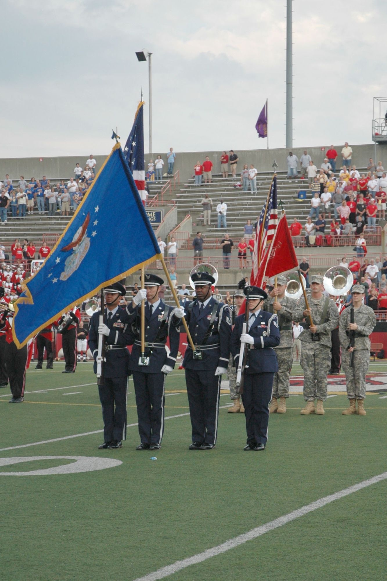 YOUNGSTOWN STATE UNIVERSITY, Ohio — The Honor Guard fromn the Air Force Reserve 910th Airlift Wing presents the colors at Stambaugh Stadium here as 370 Airmen, family members and friends from 910th, based at Youngstown Air Reserve Station, attended a pre-game tailgate lot celebration and the home opener of Youngstown State University's 2007 football season in recognition of the U.S. Air Force's 60th birthday. U.S. Air Force photo/ Tech. Sgt. Bob Barko Jr. 