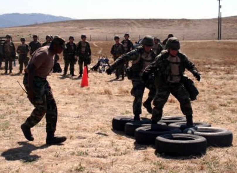 Staff Sgt. Ryan Price, 572nd Global Mobility Squadron and Airman 1st Class Matthew Brattoli, 572nd GMS, navigate the tire run, one of the obstacles in the physical agility stress course. Members were evaluated on their ability to perform under pressure throughout the Dublin Fury exercise. The 615th Contingency Response Wing will face their first Operational Readiness Inspection Oct. 10 to 18. (U.S. Air Force photo)


