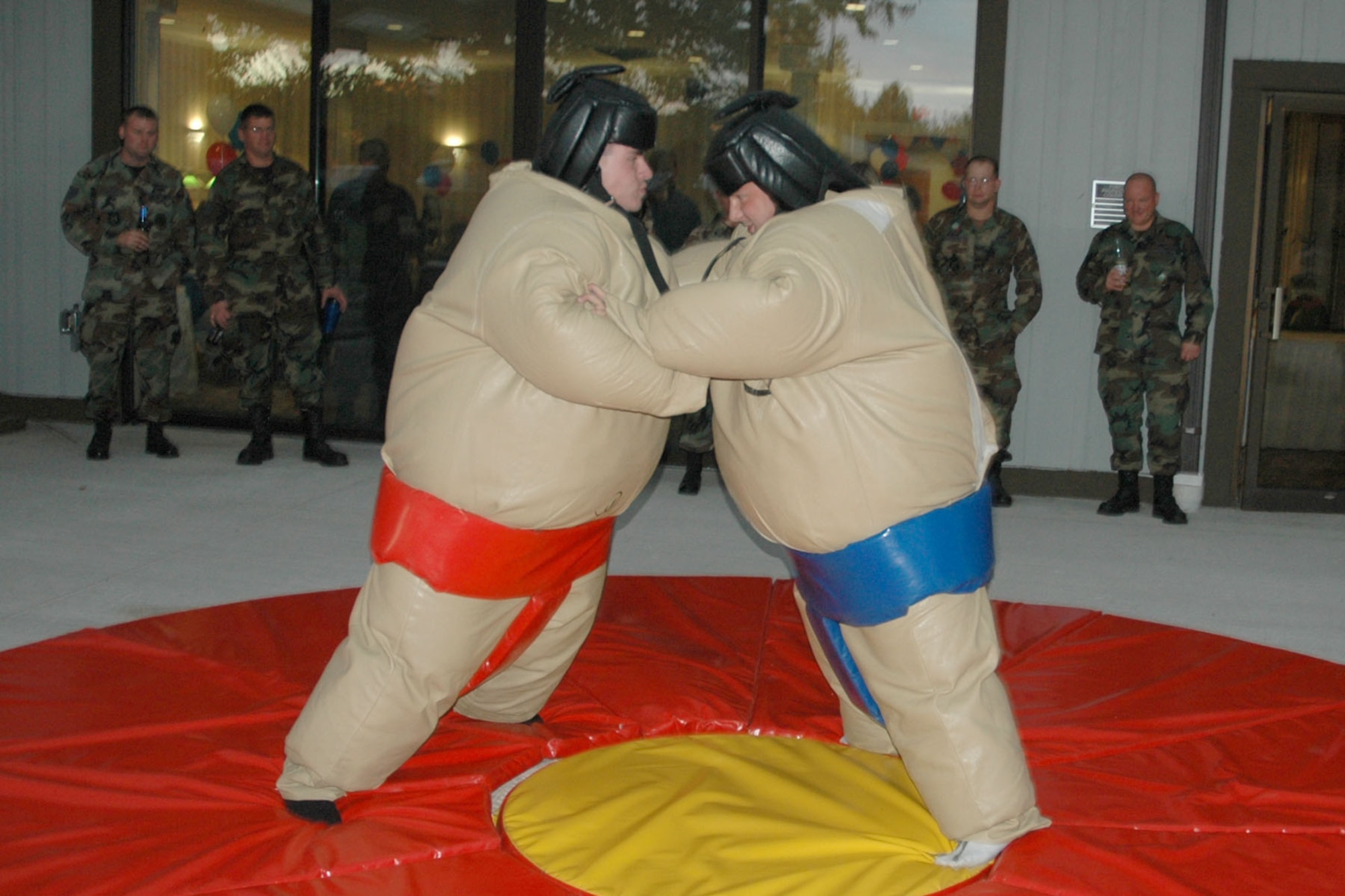 YOUNGSTOWN AIR RESERVE STATION, Ohio — A group of Air Force Reservists assigned to the 910th Airlift Wing participate in some Sumo-style fun under the canopy just outside the Eagle's Nest Club here during the facility's Grand Re-Opening celebration .U.S. Air Force photo/ Tech. Sgt. Bob Barko Jr.