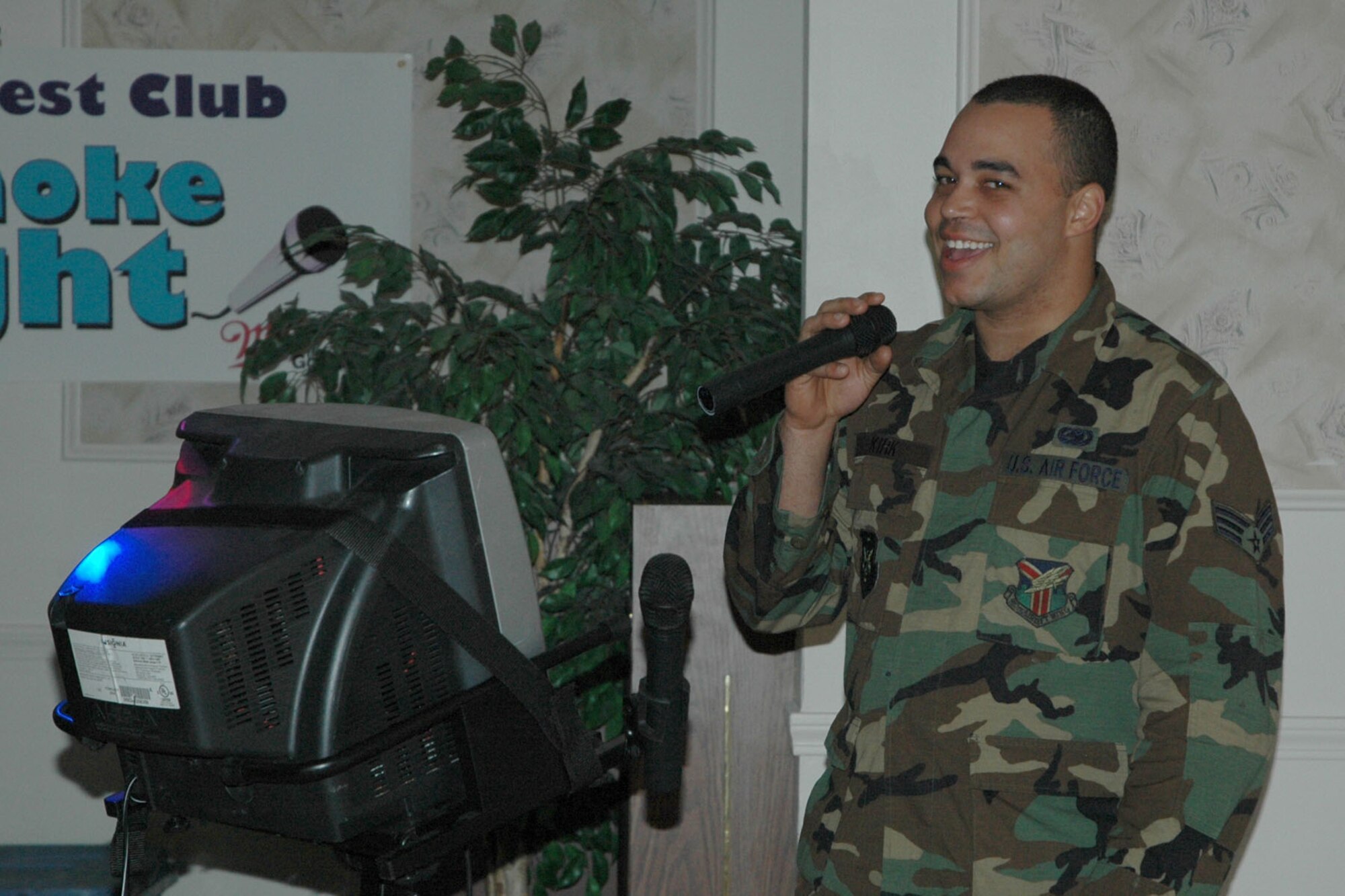 YOUNGSTOWN AIR RESERVE STATION, Ohio — Air Force Reserve Senior Airman Jason Kirk, assigned to the 910th Logistics Readiness Sqaudron, belts out a Karaoke tune at the Eagle's Nest Club here during the club's Grand Re-Opening celebration. U.S. Air Force photo/ Tech. Sgt. Bob Barko Jr.