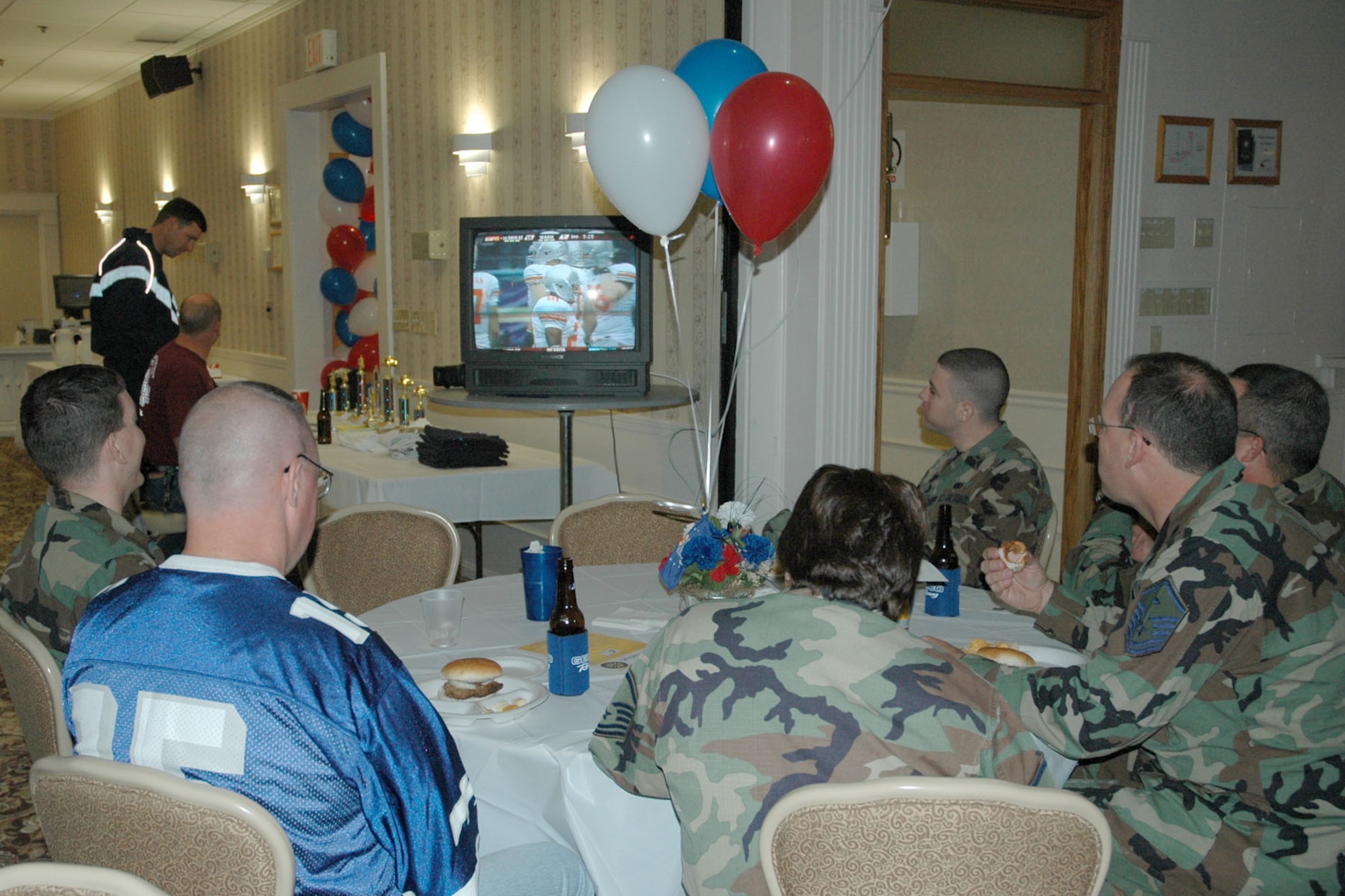 YOUNGSTOWN AIR RESERVE STATION, Ohio — Air Force Reservists assigned to the 910th Airlift Wing take in the Ohio State University Buckeye's football game shown on television at the Eagle,s Nest Club here during the club's Grand Re-Opening celebration. U.S. Air Force photo/ Tech. Sgt. Bob Barko Jr.