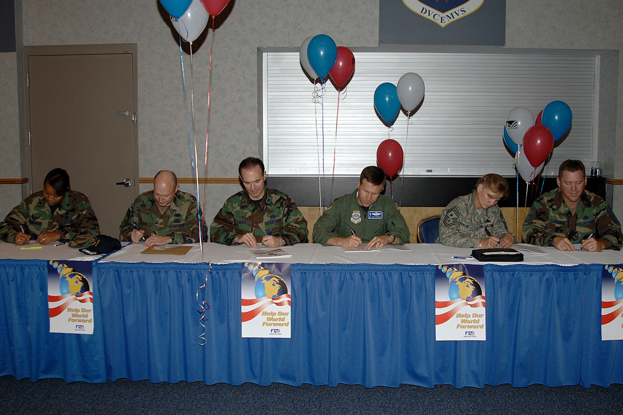 The 22nd Air Refueling Wing leadership, signs their pledges for the Combined Federal Campaign Sept. 26, at the Robert J. Dole Center ballroom. The CFC is the world’s largest and most successful annual workplace charity campaign. Last year McConnell raised around $114,000 for the CFC and this year's goal is set at $115,000. (Photo by Airman 1st Class Laura Suttles)
