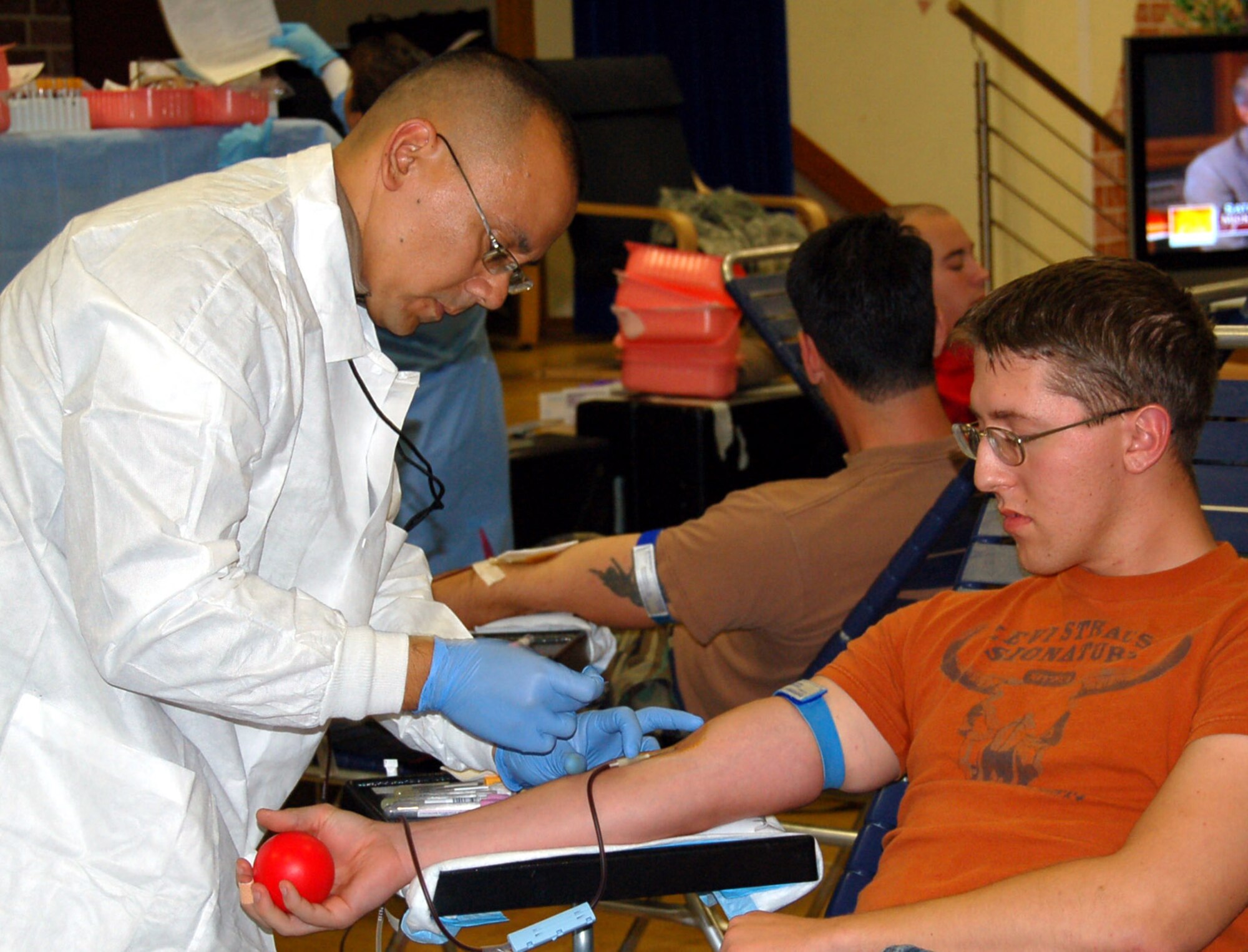 SPANGDAHLEM AIR BASE, Germany – Navy Petty Officer 1st Class Brian King, Landsthul Regional Medical Center, draws blood from Airman 1st Class Jonathan Webber, 52nd Communications Squadron, during a base blood drive Oct. 2. Sabers donated 64 units of blood during the drive. (U.S. Air Force photo/Staff Sgt. Tammie Moore)