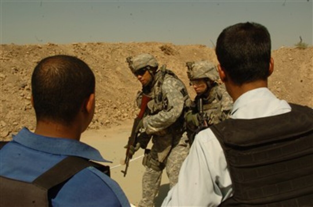 U.S. Army soldiers instruct Iraqi police officers on room-clearing procedures at Forward Operating Base Volunteer in Baghdad, Iraq, on Sept. 27, 2007.  