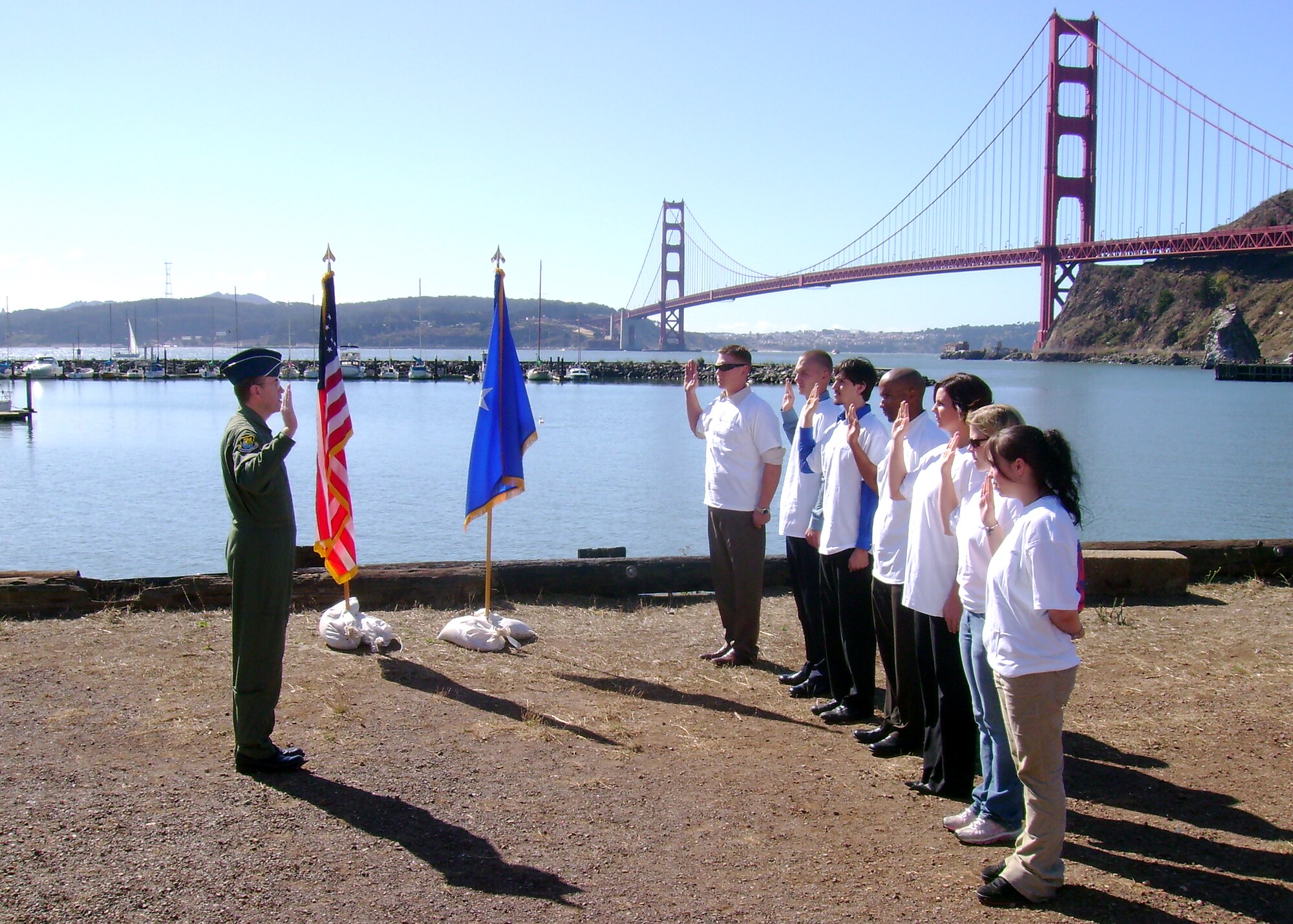 Air Force Reservist Brig. Gen. Thomas Gisler Jr., 349th Air Mobility Wing commander, enlists new Air Force Reservists during a ceremony at Travis Marina, Fort Baker, Calif. near Golden Gate Bridge Oct. 5, 2007.  The Reservists are assigned to the 349th AMW at Travis Air Force Base and the 940th Air Refueling Wing, Beale AFB.  This was the first large enlistment ceremony of the new fiscal year. The Reserve recruiters for Beale met their 2007 fiscal year goals. (U.S. Air Force photo/Master Sgt. Tony Salgado)