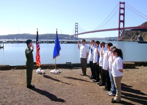 Air Force Reservist Brig. Gen. Thomas Gisler Jr., 349th Air Mobility Wing commander, enlists new Air Force Reservists during a ceremony at Travis Marina, Fort Baker, Calif. near Golden Gate Bridge Oct. 5, 2007.  The Reservists are assigned to the 349th AMW at Travis Air Force Base and the 940th Air Refueling Wing, Beale AFB.  This was the first large enlistment ceremony of the new fiscal year. The Reserve recruiters for Beale met their 2007 fiscal year goals. (U.S. Air Force photo/Master Sgt. Tony Salgado)