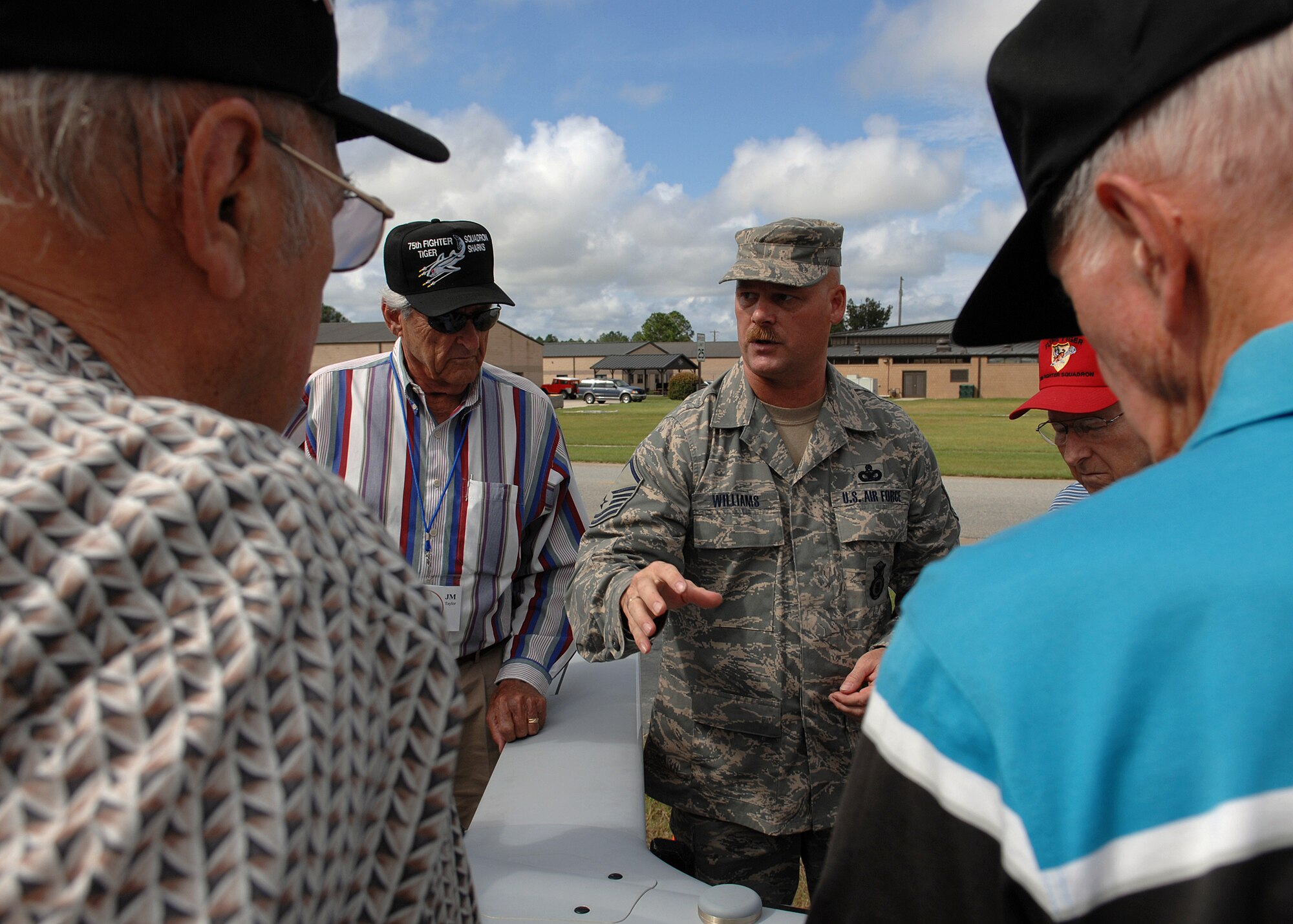 Master Sgt. Bryan Williams, 823rd Security Forces Squadron, explains the abilities of the scan eagle system to members of the Flying Tiger Association Oct. 4 during a three-day Flying Tiger Association Reunion held at Moody Air Force Base, Ga., Oct. 4-6. More than 25 original World War II era Flying Tiger members attended the reunion.(U.S. Air Force photo by Airman 1st Class Brittany Barker) 