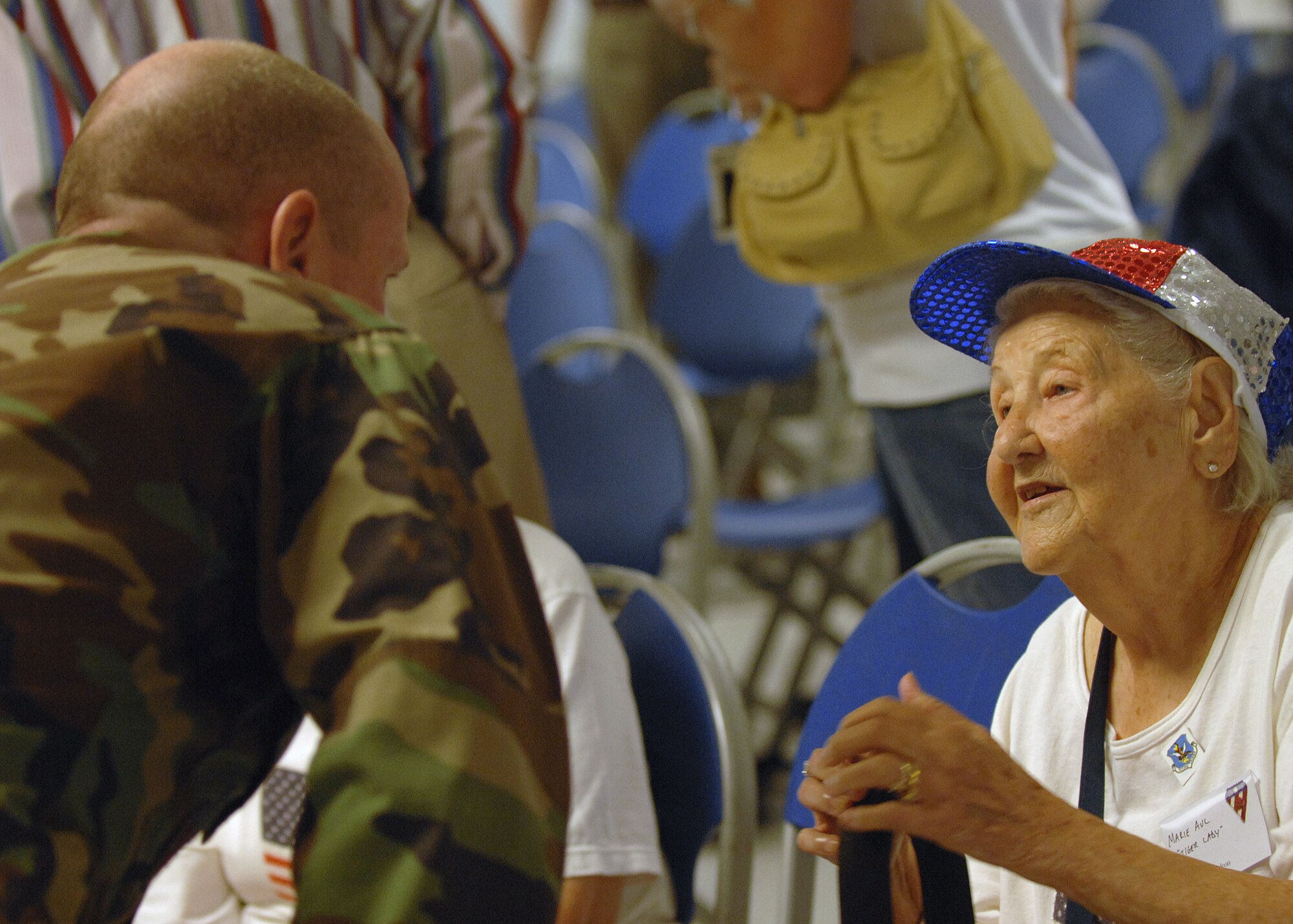 Col. John Decknick, commander of the 820th Security Forces Group, greets Marie Aul, retired Flying Tiger spouse, at a briefing Oct. 4 during the Flying Tiger Association Reunion held at Moody Air Force Base, Ga., Oct. 4-6. (U.S. Air Force photo by Airman 1st Class Brittany Barker)