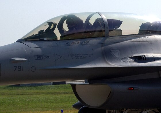 Lt. Col. Shane Riza arrives at Kunsan Air Base, South Korea, Oct. 2 in a new Block 40 F-16 Fighting Falcon.  He and three other pilots from Kunsan's 8th Fighter Wing traveled to Eielson Air Force Base, Alaska, to fly the upgraded fighters to Kunsan.  Colonel Riza is the 80th Fighter Squadron director of operations.  (U.S. Air Force photo/Senior Airman Steven R. Doty)