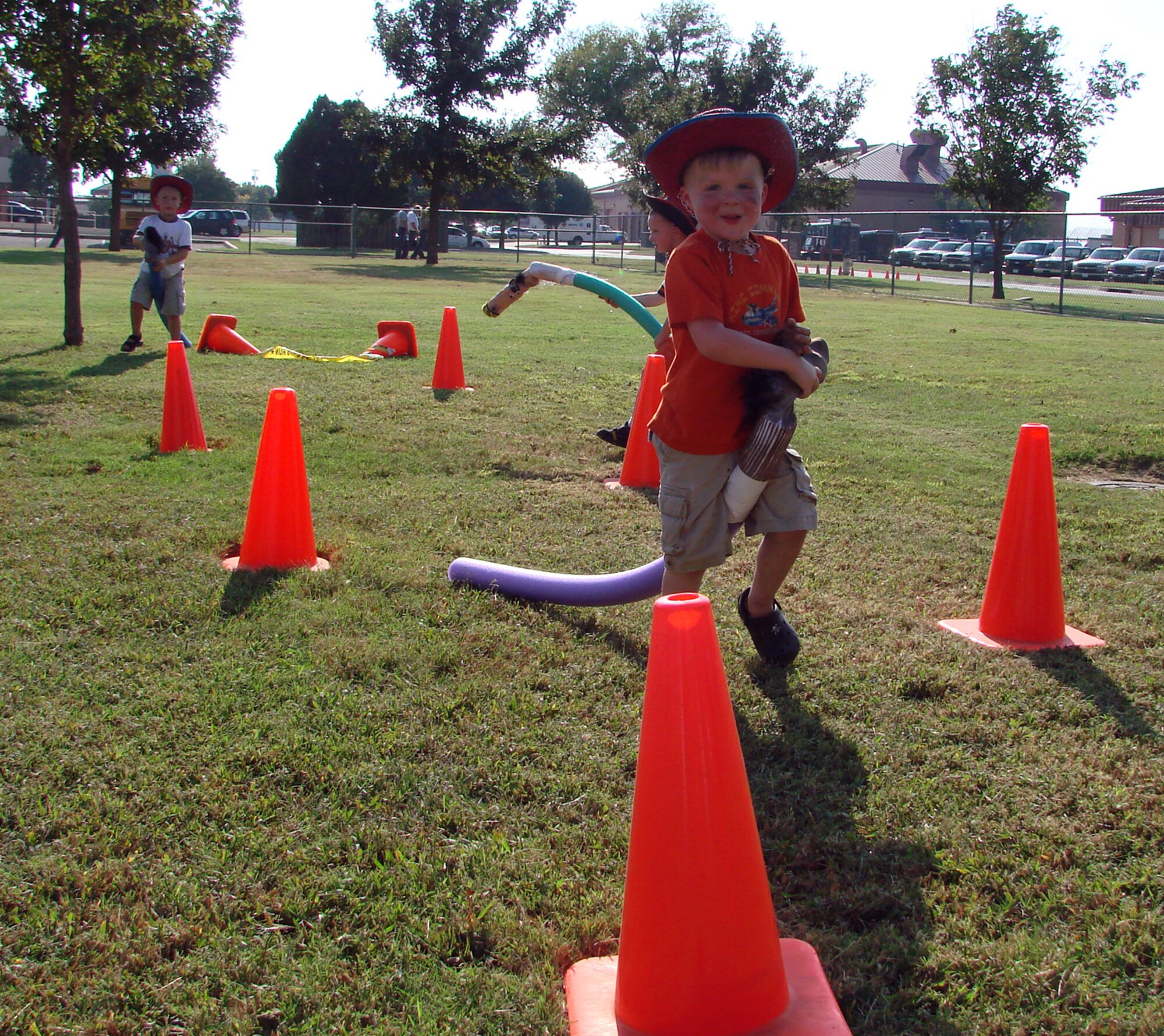Billy George, 3, and his trusty charger make their way through an obstacle course during Fall Fest 2007. Billy is the son of Tina and Capt. Bill George with the 25th Flying Training Squadron. (U.S. Air Force photo by Tech. Sgt. Mary Davis)       