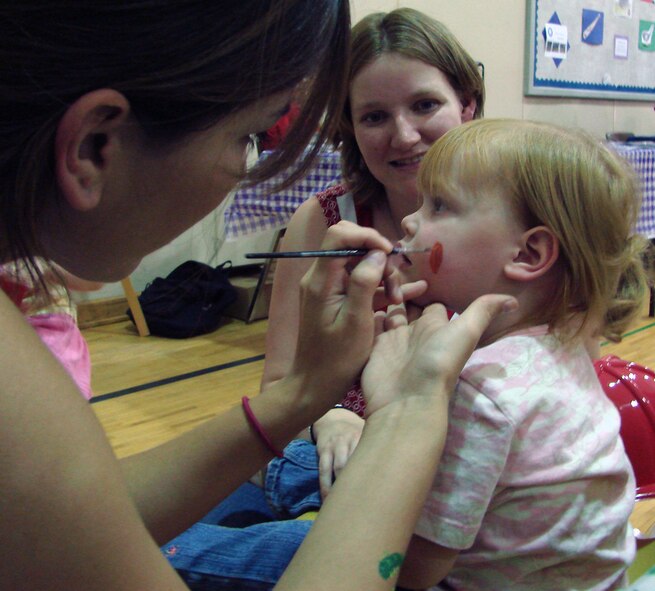 Kyler Hryhorchuk, 2, gets her face painted at Fall Fest 2007 Oct. 4 at the Vance Youth Center. Kyler is the daughter of Kara and 1st Lt. Mark Hryhorchuk with the 33rd Flying Training Squadron.  (U.S. Air Force photo by Tech. Sgt. Mary Davis)