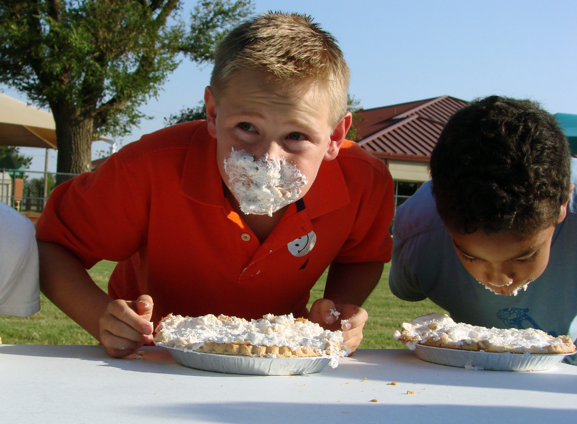 Matt Beale, 10, scarfs down pie during the Fall Fest 2007 pie-eating contest Oct. 4. Matt is the son of Michelle and Master Sgt. Mark Beale with the 71st Logistics Readiness Squadron. (U.S. Air Force photo by Tech. Sgt. Mary Davis)