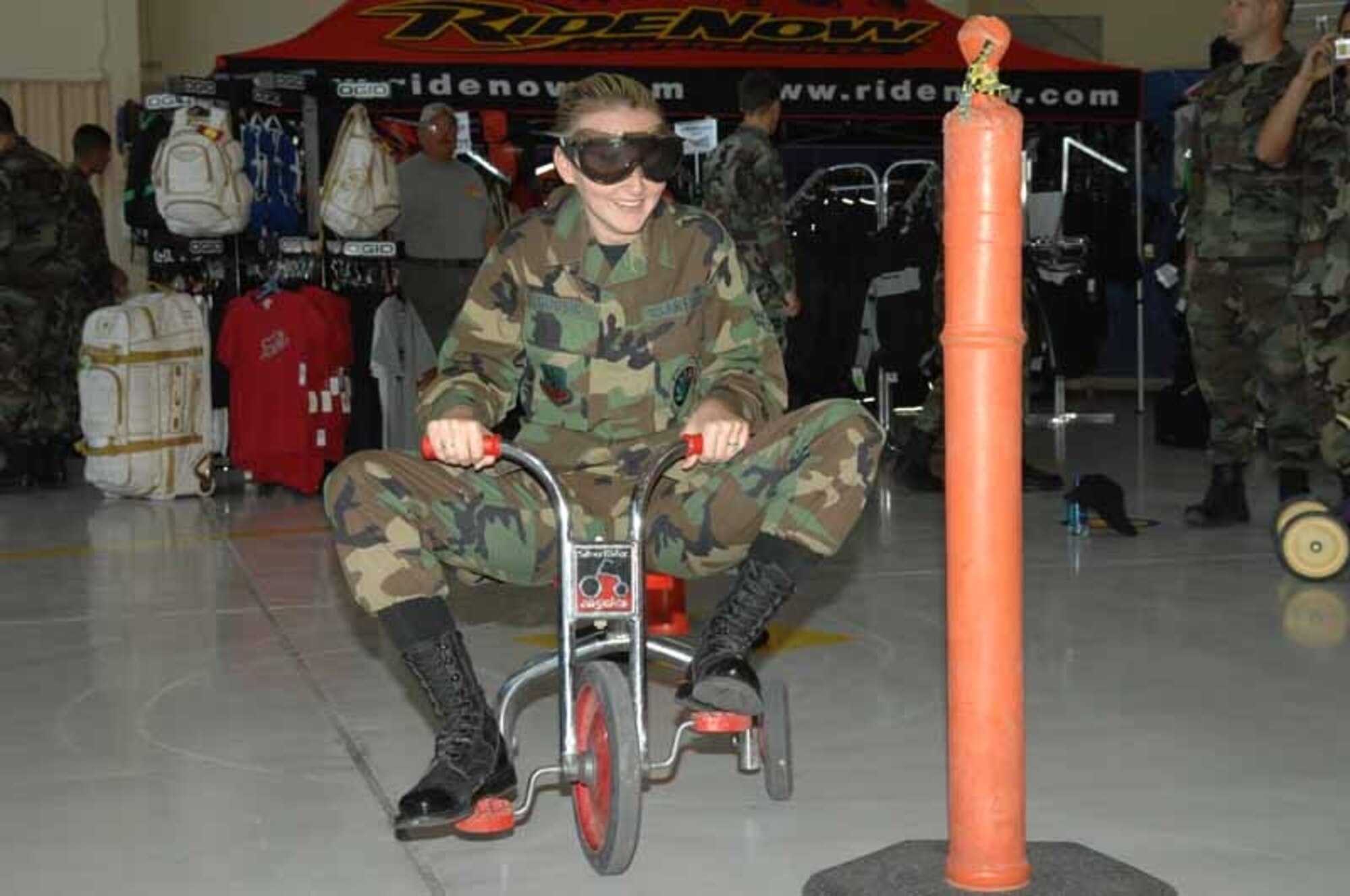 Airman 1st Class Alesia Goosic, 355th Fighter Wing photographer, attempts to maneuver a tricycle around construction cones while wearing drunk goggles during the wing’s Safety Day event here Sept. 27. Drunk goggles simulate what it’s like being under the influence. The annual Safety Day is held to mark the end of the 101 Critical Days of Summer Campaign. (U.S. Air Force photo by Airman 1st Class Noah Johnson)
