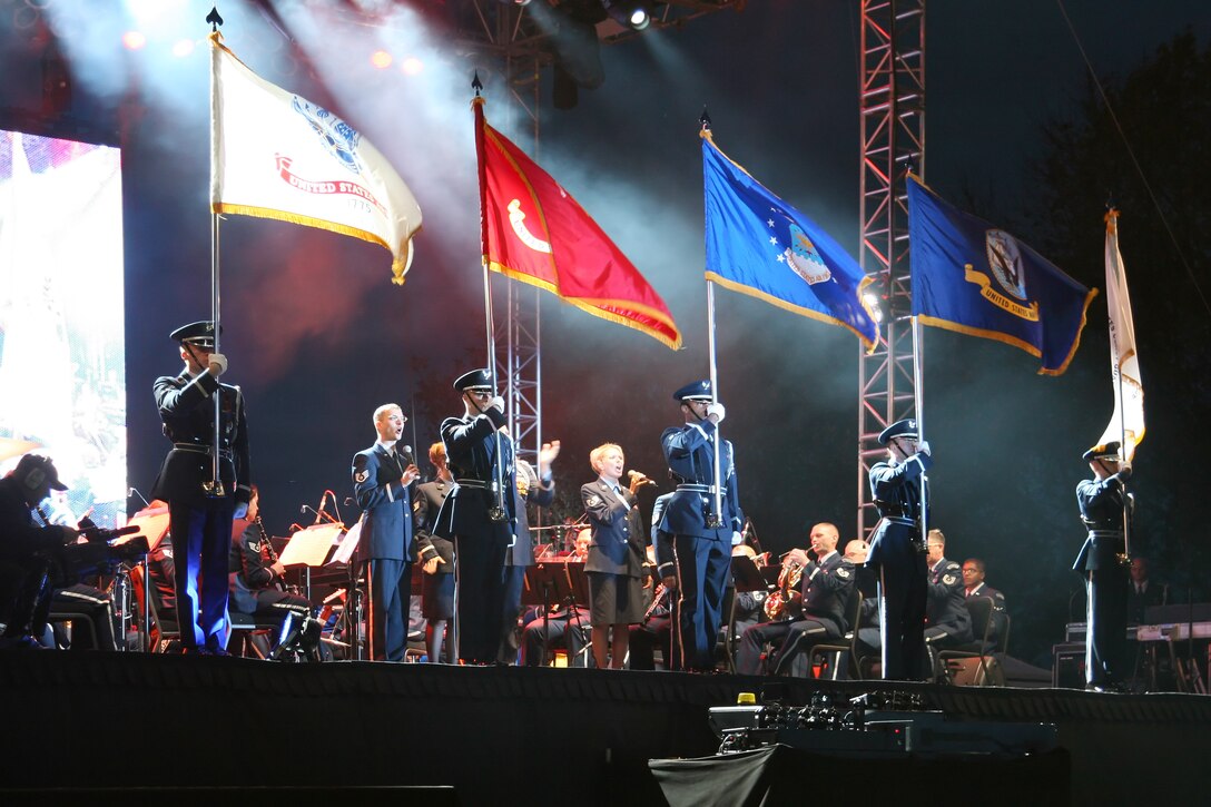 The USAF Heartland of America Band honors members of all branches of military service by proudly displaying each services' flag. This performance was part of the multi-media presentation of the 55th Wing's military Tattoo, "The Call of Freedom," in October 2006. 