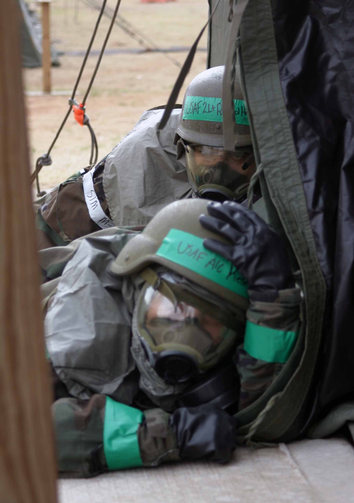 During last year's exercise, Airmen practiced taking cover in full chemical warfare gear. (Air Force photo by Staff Sgt. Stacy Fowler)