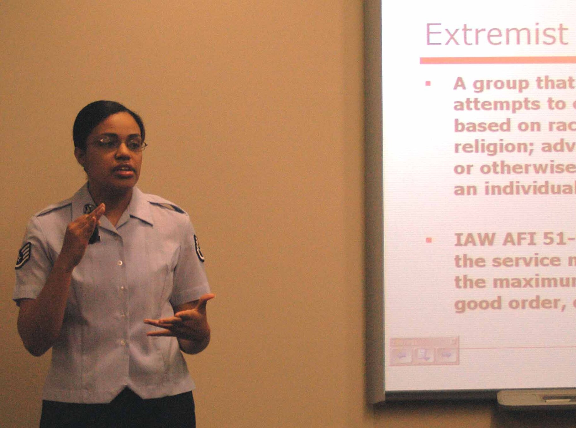 Military Equal Opportunity Staff Sgt. Jasmine Barnes identifies the extremist groups in Oklahoma in a newcomer's briefing Sept. 28 at the Family Support Center. (Air Force photo by Kandis West)