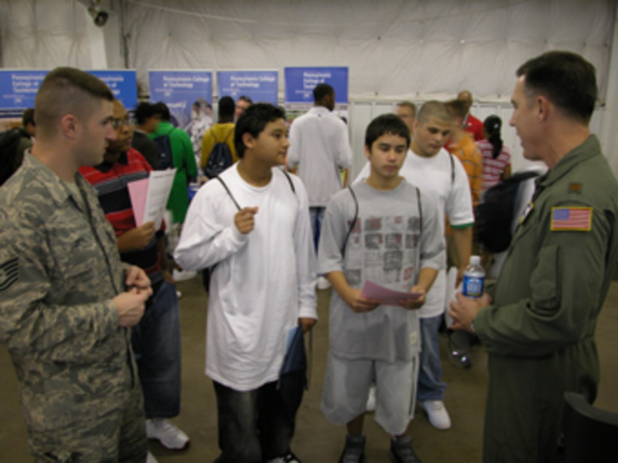 MANASSAS, Va. -- Tech. Sgt. Matthew Laney, 459th Recruiting Squadron and Maj. Eddie Miller, 756th Air Refueling Squadron, talk to a couple of high school students at the Virginia Department of Transportation and Woodrow Wilson Bridge Project's 2007 Career Fair at the Prince William County Fair Grounds Oct. 4.  The career fair's goal is to show students opportunities and careers in transportation.  This year's theme is "Transportation: Your Ride to the Future!" The 459th Air Refueling Wing, an Air Force Reserve unit, participates each year. (U.S. Air Force Photo / Capt. Tim Smith)