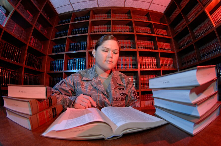 MINOT AIR FORCE BASE, N.D. -- Tech. Sgt. Aiko Riffle, a military justice paralegal for the 5th Bomb Wing legal office, reviews a case inside the law library in the legal office here on Oct. 4. Sergeant Riffle assists Staff Judge Advocates during court cases. (U.S. Air Force photo by Senior Airman Christopher Boitz) 