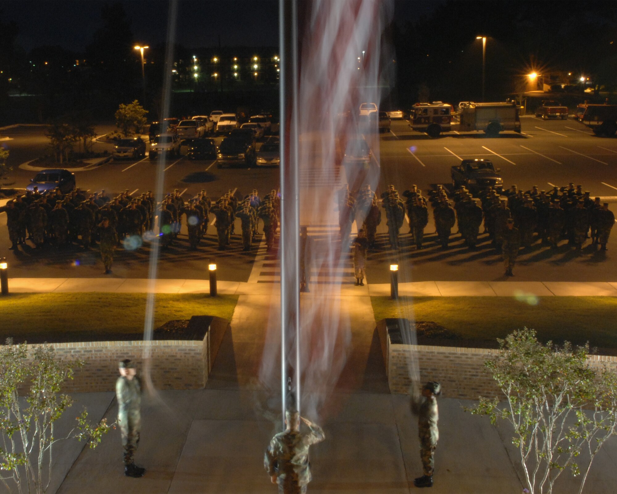 MOODY AIR FORCE BASE, Ga. -- Members of the 23rd Civil Engineer Squadron perform a reveille ceremony at the Parker Greene Base Support Center here Oct. 5.  (U.S. Air Force photo by Airman 1st Class Brittany Barker) 