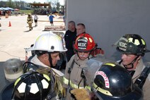 The Arnold Engineering Development Center firefighter team huddle before one of the tasks. (Photo by Rick Goodfriend)