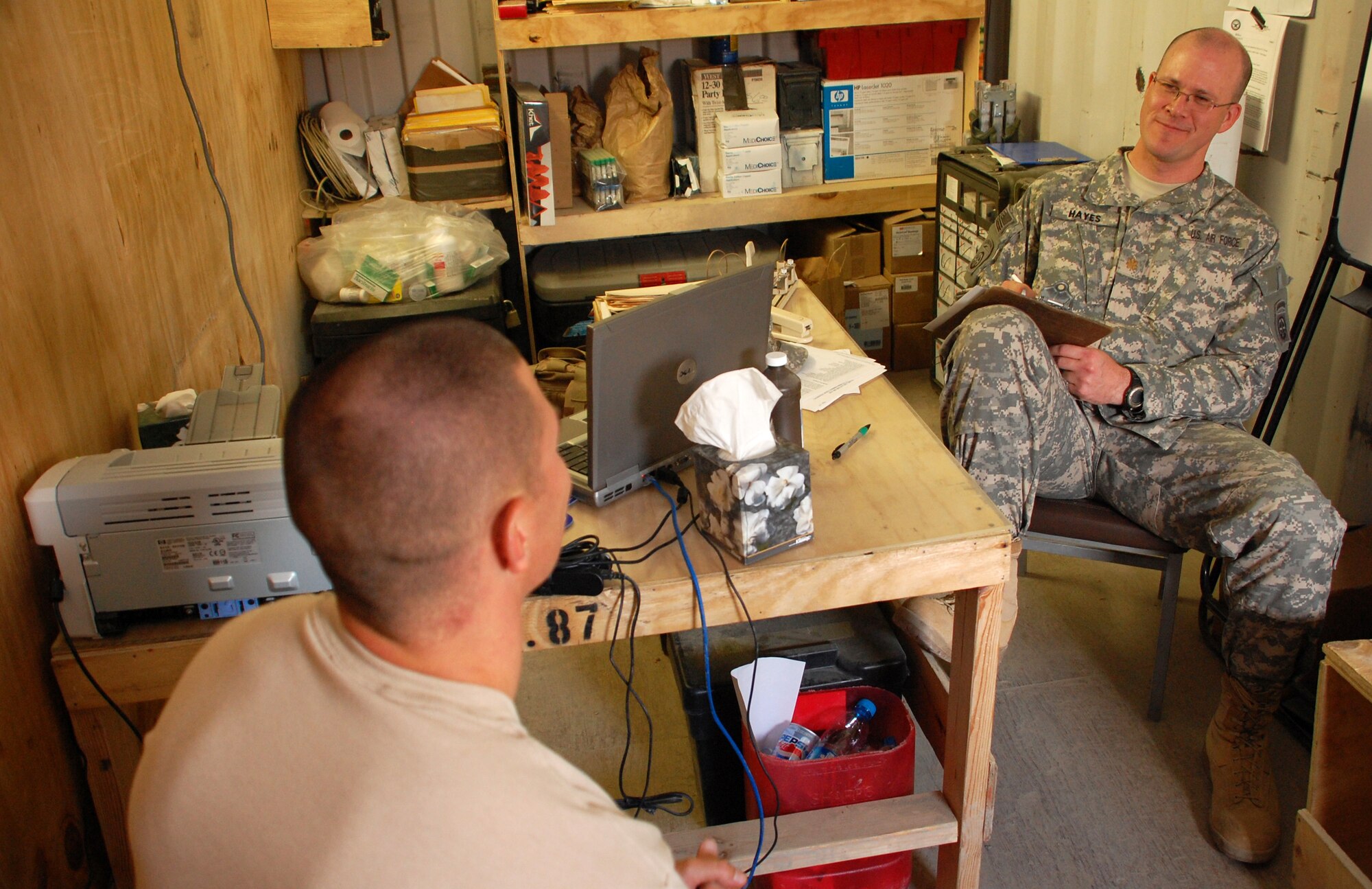 Air Force Maj. (Dr.) Marshall Hayes (right) speaks with a Soldier in his office. As a doctor, Hayes is bound by confidentiality.  The only reason we would break confidentiality is if there's a danger to themselves, danger to other people or danger to the mission," he said.
