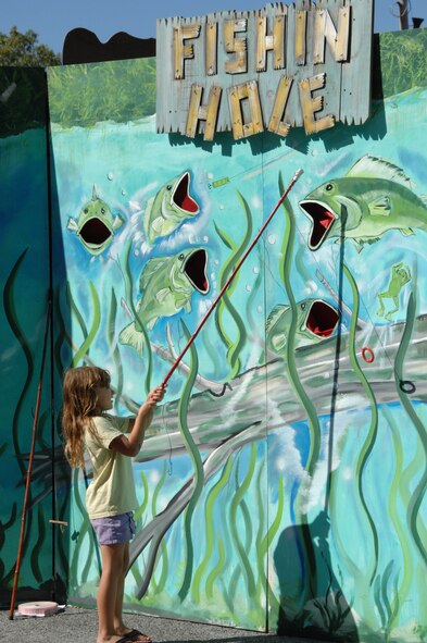 Surrounding communities came out to Arnold’s Gossick Leadership Center recreation area to celebrate the Air Force’s 60th birthday Sept. 30. Carnival games, mini rides and lots of food were available along with live music and fireworks. (Photos by David Housch)