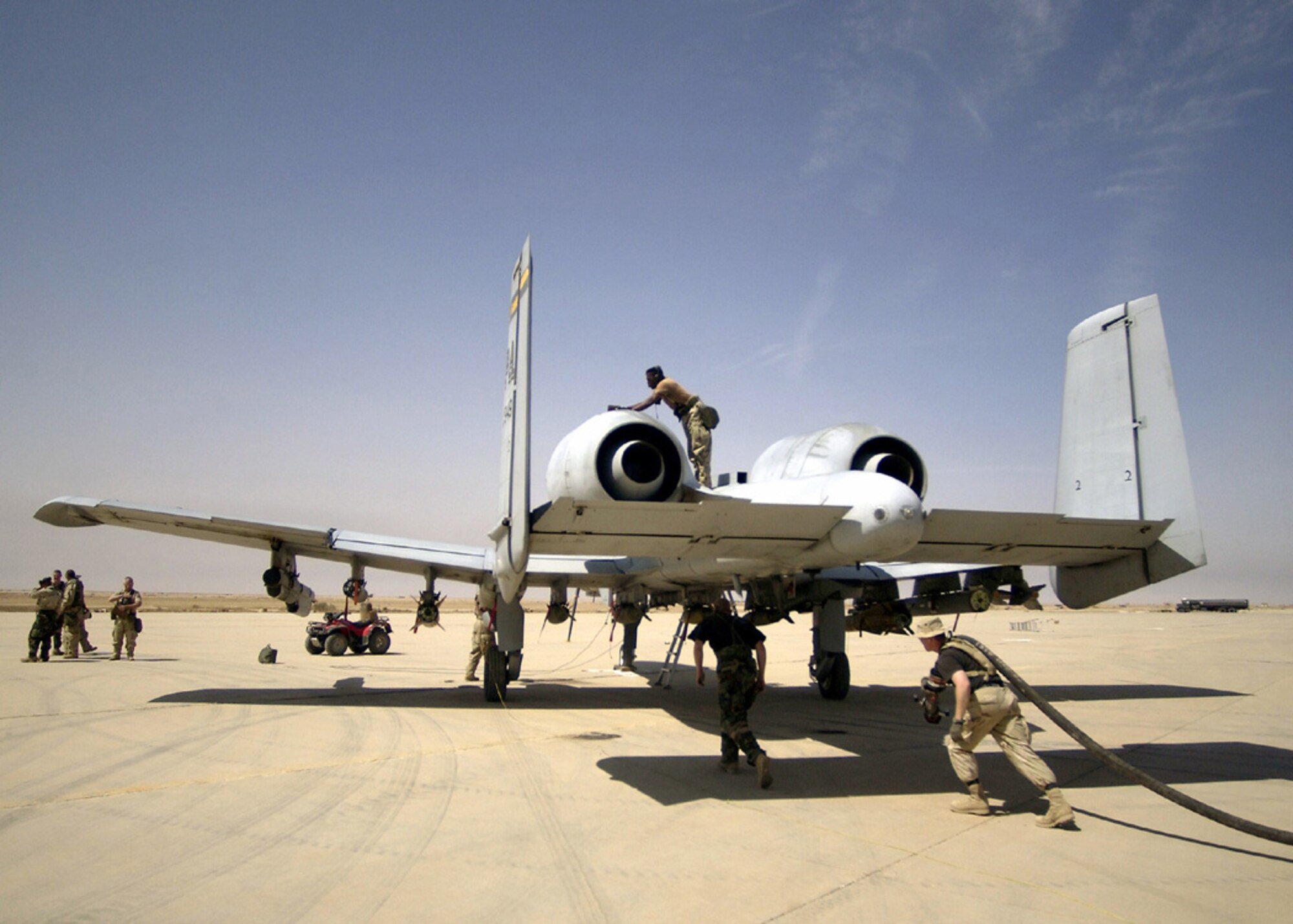 392nd Air Expeditionary Wing aircraft maintenance personnel inspect and refuel an A-10 Thunderbolt II aircraft at a forward-deployed location in Southern Iraq in support of Operation Iraqi Freedom. (U.S. Air Force photo/Staff Sgt. Shane Cuomo)