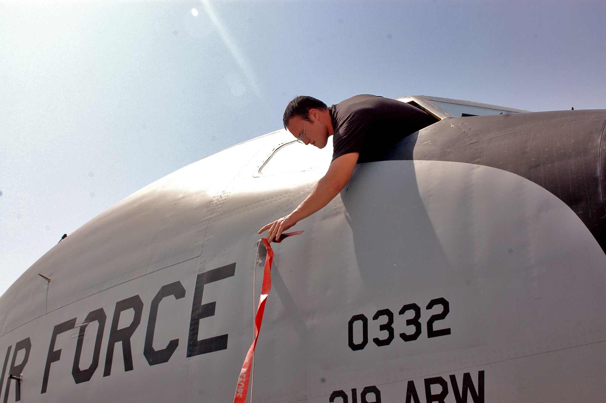 SOUTHWEST ASIA -- Senior Airman Mike McGovern, deployed to the 340th AMU from Grand Forks AFB, ND, places a cover on an air data probe of a KC-135. The cover prevents foreign objects from damaging and pluggin the air data probe so taht the pilots receive accurate and vital information. (U.S. Air Force photo/Staff Sgt. Jason Barebo)