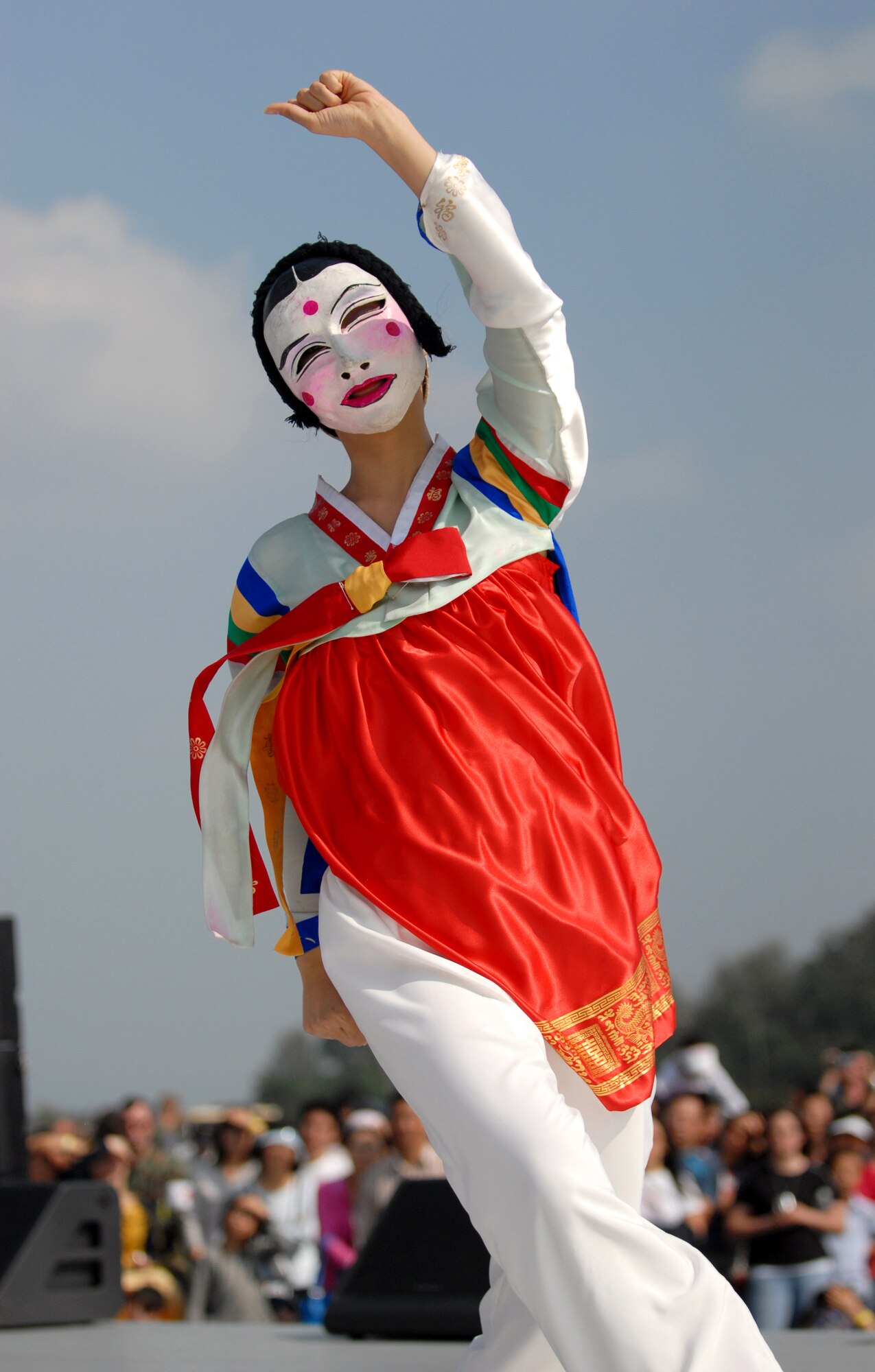 OSAN AIR BASE, Republic of Korea -- A Korean folk dancer wears a two-faced mask in her performance at Osan's Air Power Day, October 7. (U.S. Air Force photo by 1st Lt John Ross)