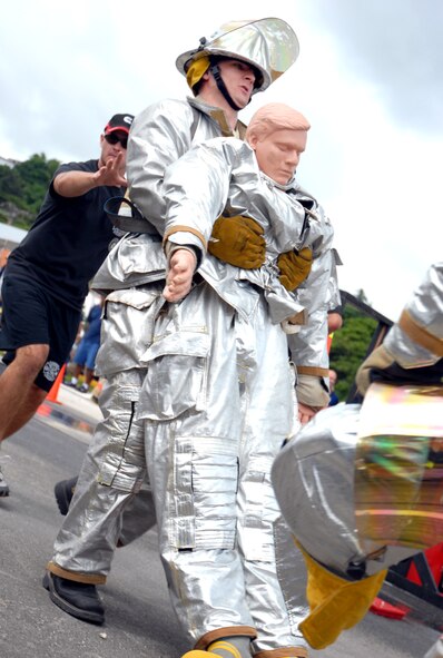 ANDERSEN AFB, GUAM---Firefighter, Staff Sergeant Brent Watkins, 36th Civil Engineering Squadron , participates in the team relay portion of the 2nd Annual Island-Wide Firefighter Muster that was held at the Agana Shopping Center, October 6, 2007, in conjuction with Fire Prevention Week.  Andersen's Firefighters placed second overall for both days that the event was held.(U.S. Air Force photo by Senior Airman Miranda Moorer)(RELEASED)                                     