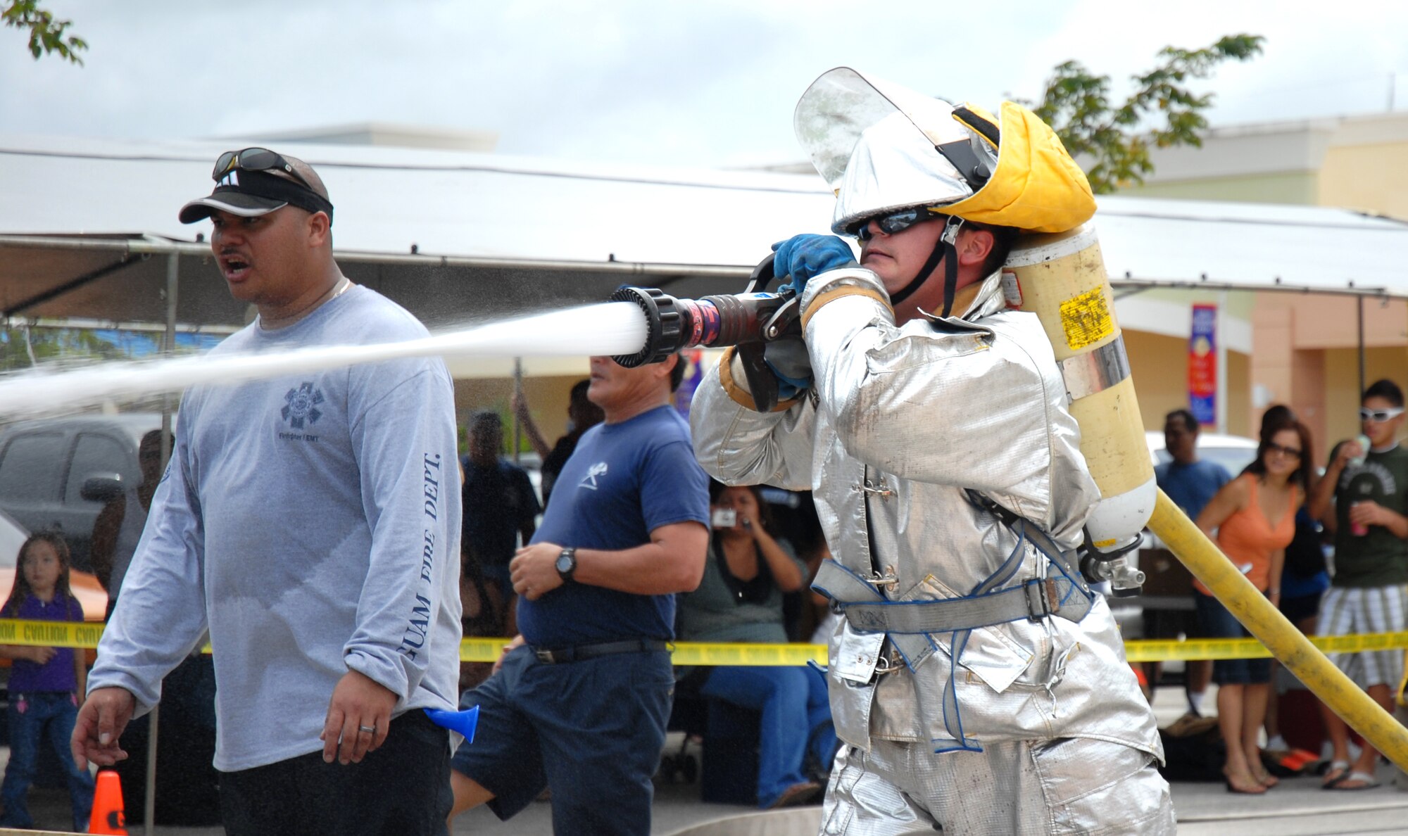 ANDERSEN AFB, GUAM---Firefighter, Senior Airman Thomas Mix, 36th Civil Engineering Squadron, hoses down a simulated fire, October 6, 2007, during the 2nd Annual Island-Wide Firefighter Muster that was held at the Agana Shopping Center in conjuction with Fire Prevention Week.  Andersen's Firefighters placed second overall for both days that the event was held.
(U.S. Air Force photo by Senior Airman Miranda Moorer)(RELEASED)                                     