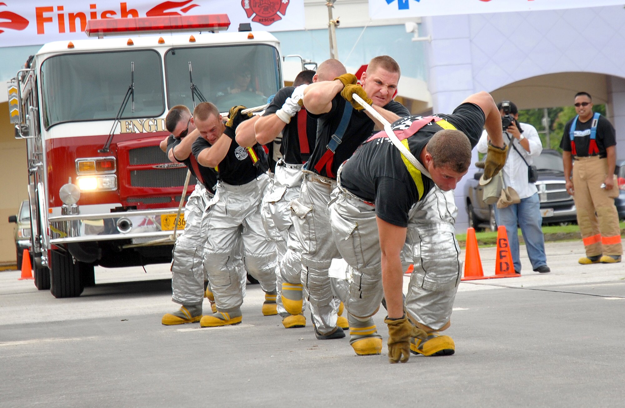 ANDERSEN AFB, GUAM---Andersen firefighters pull a fire engine, October 6, 2007, during the 2nd Annual Island-Wide Firefighter Muster that was held at the Agana Shopping Center in conjuction with Fire Prevention Week.  Andersen's Firefighters placed second overall for both days that the event was held.  Mr. Eric Masur, 36th Civil Engineering Squadron, placed first in the solo relay event.
(U.S. Air Force photo by Senior Airman Miranda Moorer)(RELEASED)                                     