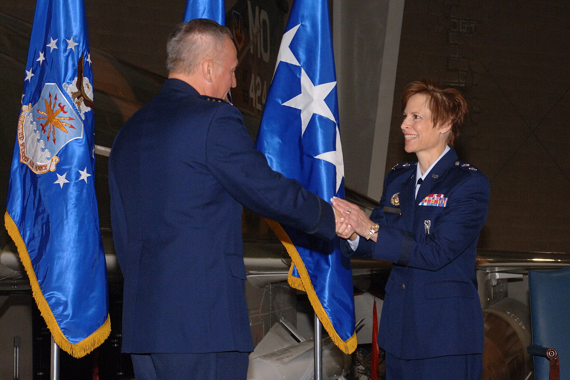 HILL AIR FORCE BASE, Utah-- Gen. Bruce Carlson, commander of the Air Force Material Command, congratulates Maj. Gen. Kathleen Close, Ogden Air Logistics Center commander, during her promotion ceremony, Oct. 4. General Carlson presided the ceremony and administered the oath.(U.S. Air Force photo by Alex R. Lloyd) 