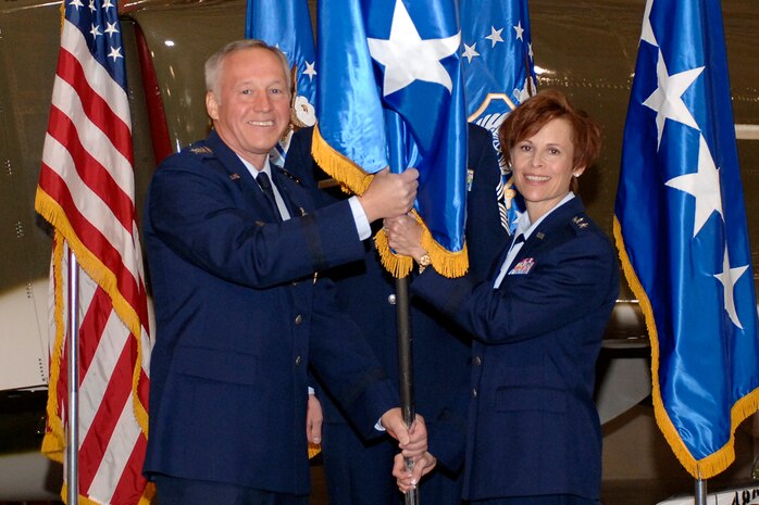 HILL AIR FORCE BASE, Utah-- Gen. Bruce Carlson, commander of the Air Force Material Command, participates in a change of flag ceremony during Maj. Gen. Kathleen Close's, Ogden Air Logistics Center commander, promotion ceremony, Oct. 4. (U.S. Air Force photo by Todd Cromar) 