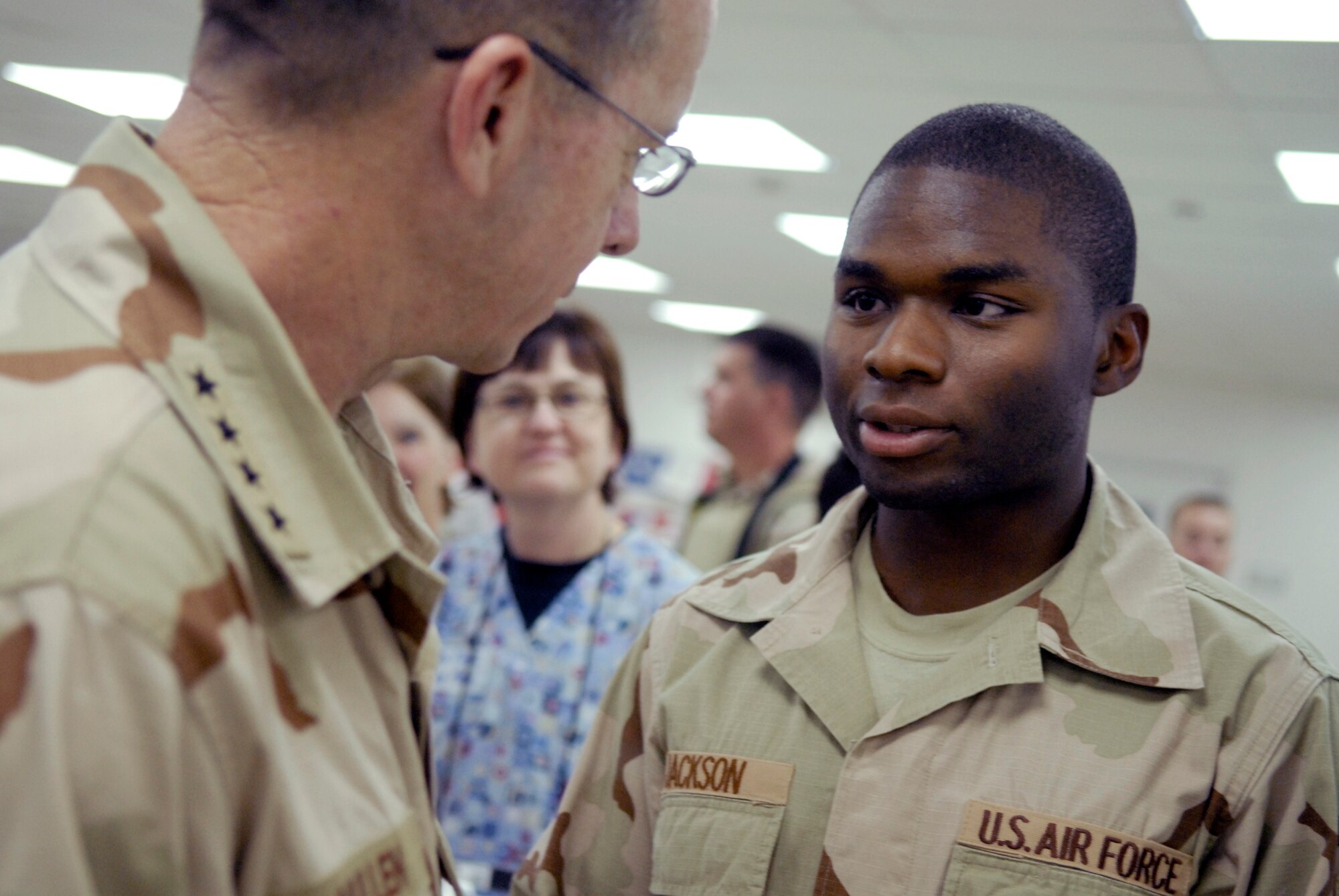 Senior Airman Dexter Jackson, 332nd Expeditionary Medical Operations Squadron, greets Adm. Mike Mullen, Chairman of the Joint Chiefs of Staff, during Adm. Mullen's visit to Balad Air Base's Air Force Theater Hospital. 