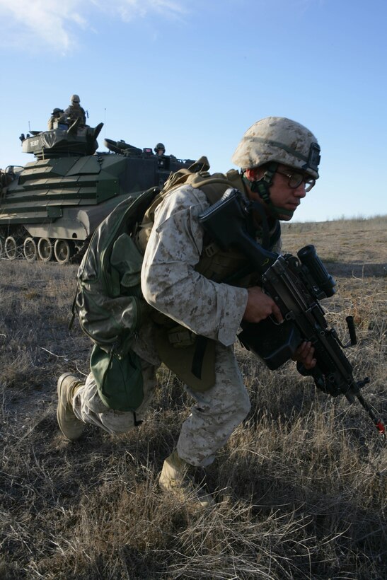 CAMP PENDLETON, CA-071007-Marines from Bravo Company, Battalion Landing Team 1st Battalion, 5th Marine Regiment, 11th Marine Expeditionary Unit dismount AAV's while moving to preform a cordon and search prior to a humanitarian assistance mission on Camp Pendleton October 7, 2007.  Marines and Sailors are conducting their Certification Exercise 08-1 in preparation for their upcoming WestPAC deployment later this year.(Official Marine Corps Photo by Sgt. Bryson K. Jones)