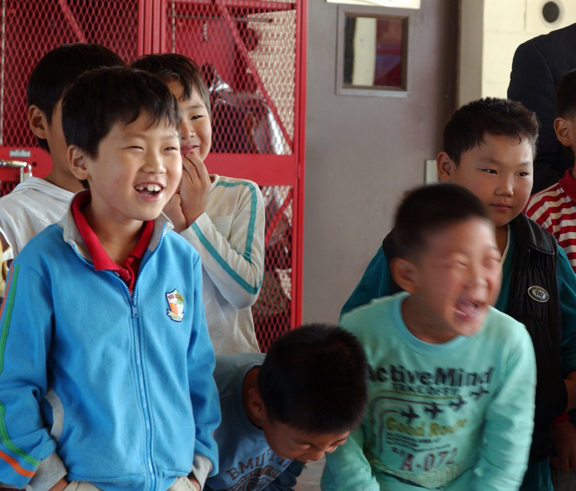 KUNSAN AIR BASE, South Korea -- Korean students show their enjoyment during their visit to the fire department here Oct. 9.  The children were from several schools throughout Gunsan City, South Korea. They toured the base fire station as part of Fire Prevention Week. (U.S. Air Force photo/Senior Airman Steven R. Doty)