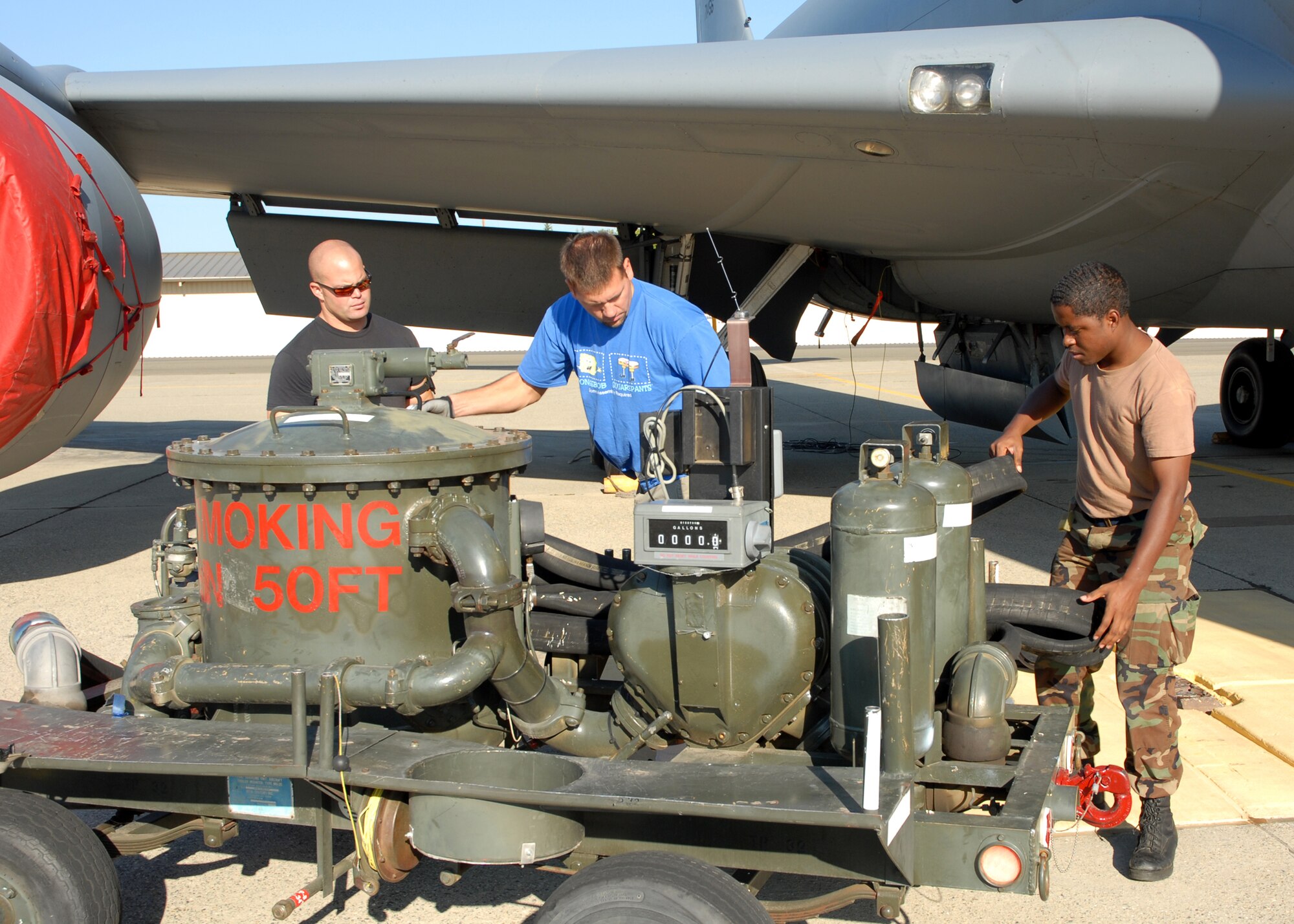 Total Force Integration is reality at Beale Air Force Base, Calif. as Air Force Reservists Senior Airman Reed Black, 940th Maintenance Group crew chief, and Tech. Sgt. Robert Greiner, 940th Aircraft Maintenance Squadron crew chief, and Active Duty Airman First Class Tyronne Cox, 9th Logistics Readiness Squadron fuel distribution operator, prepare to refuel a KC-135 Stratotanker for a mission Sept. 27, 2007. The Air Force continues to benefit from one powerful, cohesive team formed by Active Duty Airmen, Air National Guardsmen, and Air Force Reservists at Beale. (U.S. Air Force photo/Stacey Knott)